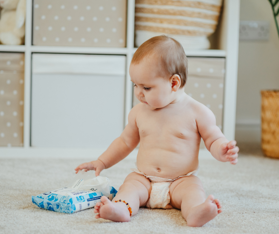 Child holding flushable toddler wipes